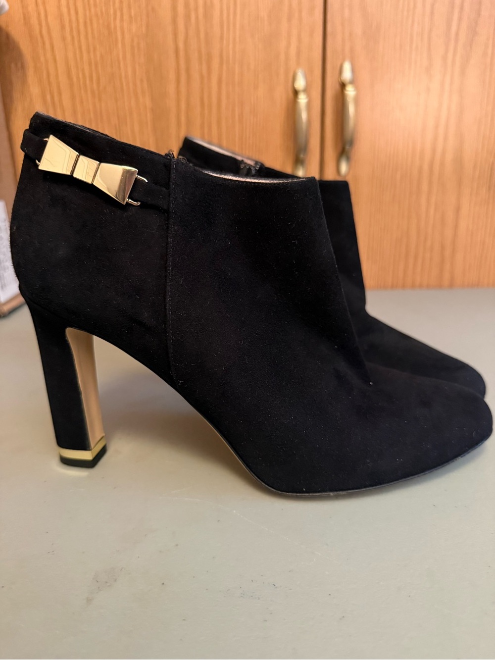 kate spade Black Suede Ankle Booties with Gold Bow and Heel